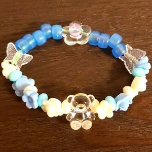 Home made bead bracelet: teddy bear in the garden